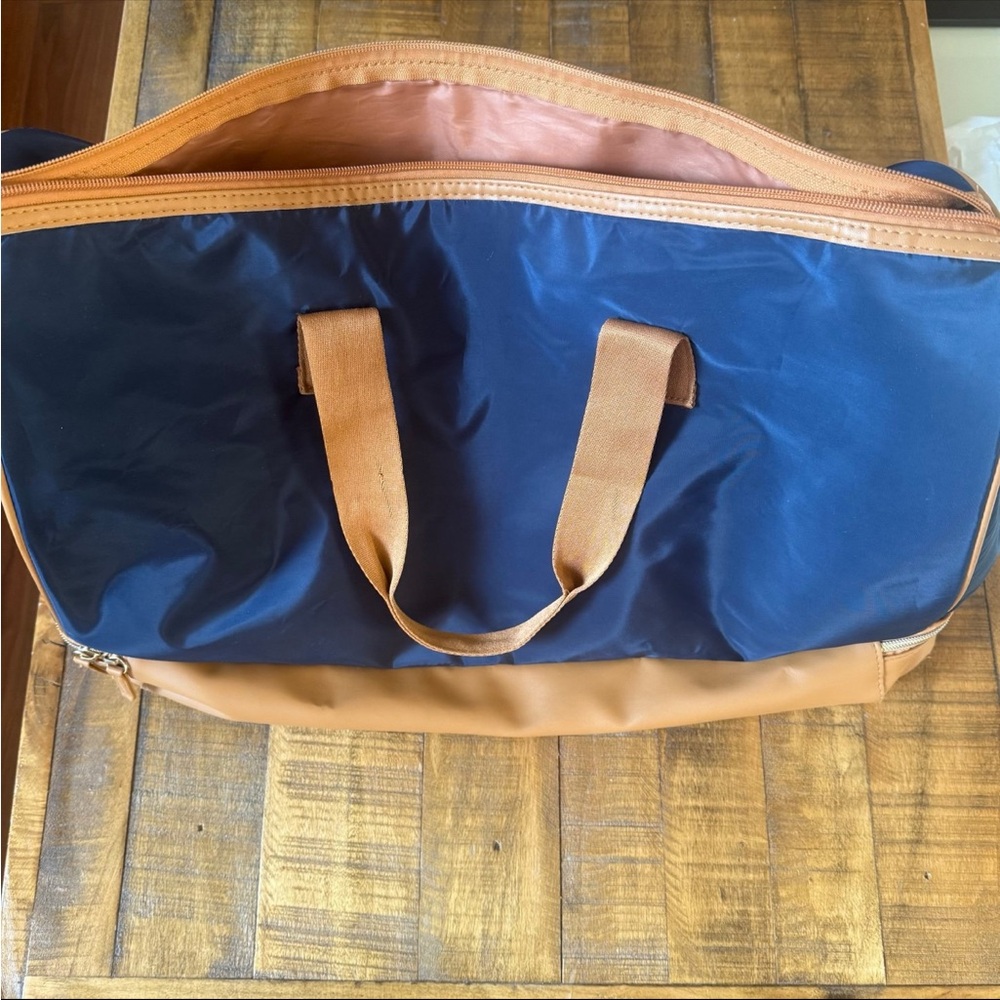 DSW navy duffel bag with zip compartment underneath. wear shown in photos